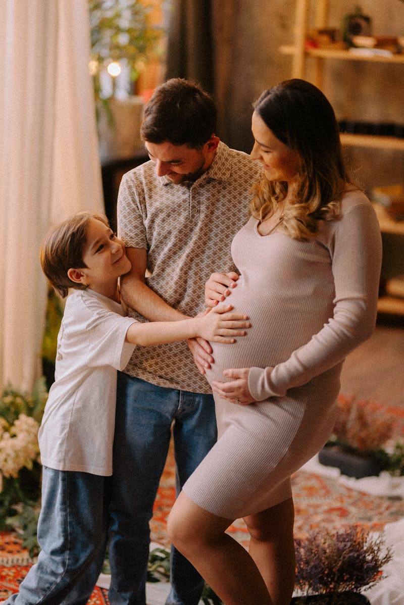 An expecting family at home