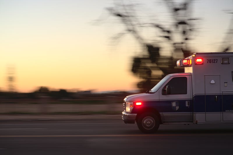 An ambulance responding to a maternal emergency at dusk