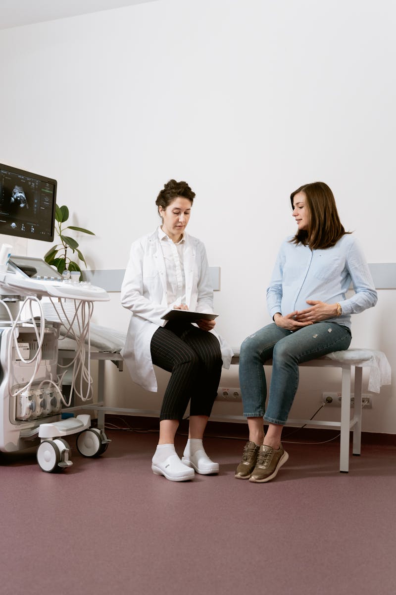 A care provider with an expecting mother during an ultrasound