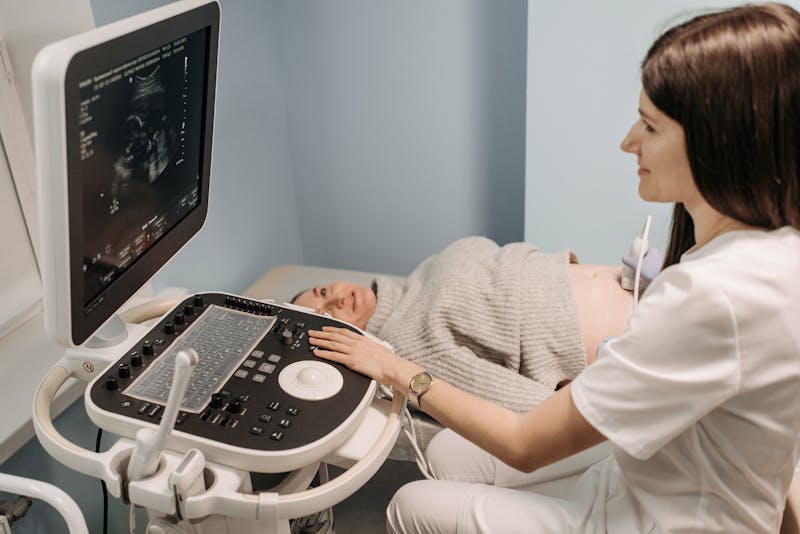 A doctor reviewing details with an expecting mother